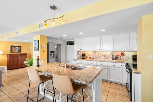 a spacious bedroom with a bed and window