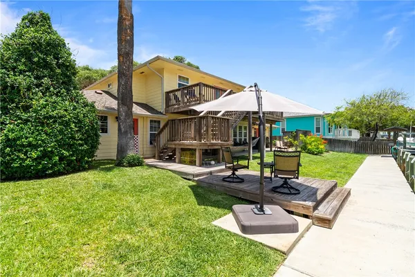 a view of living room with furniture and floor to ceiling windows