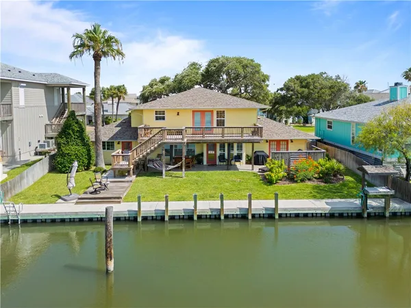 a view of house with swimming pool yard and outdoor seating