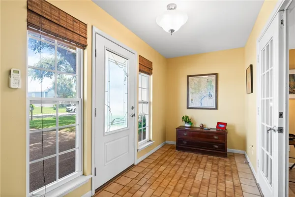 a view of entryway with wooden floor and stairs