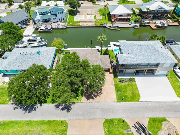 an aerial view of a house with a yard and garden