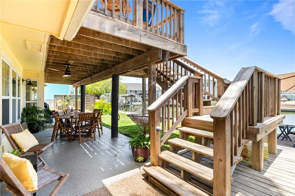 a view of balcony with wooden floor and barbeque oven