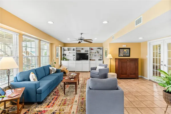 a living room with furniture and a large window