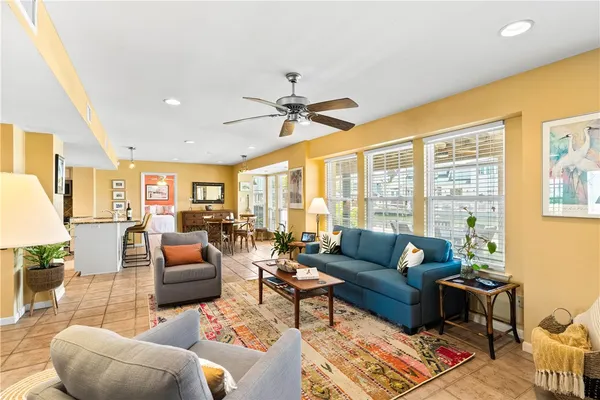 a view of a kitchen with kitchen island granite countertop a large window in it