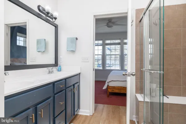 a en suite bathroom with a sink and a mirror