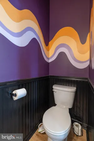 a park view with a bench in front of the house