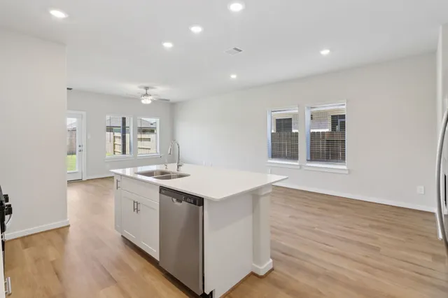 a kitchen with a stove and a sink