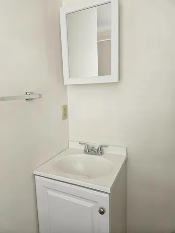 a bathroom with a sink and a vanity