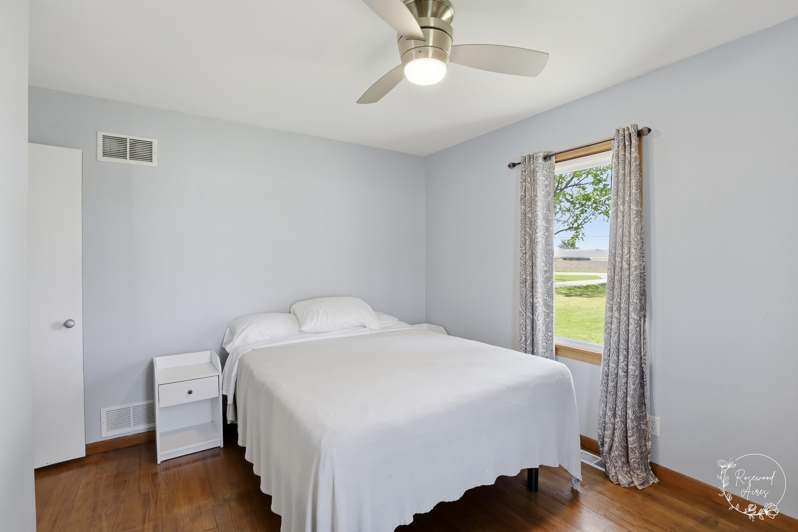 1769 West 2000S Road Kankakee, IL 60901 - Photo 11 of 39 a bedroom with a bed and wooden floor