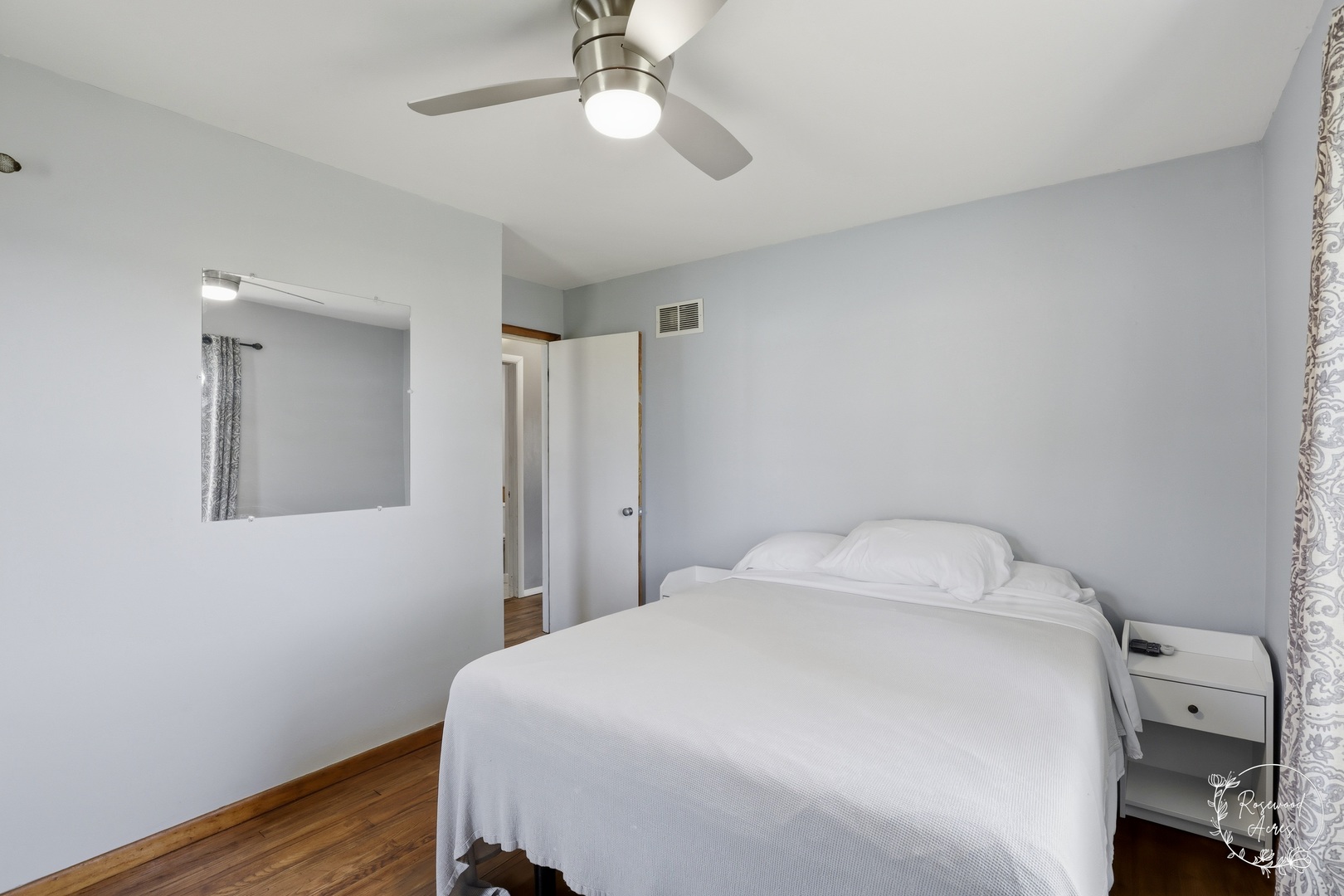 1769 West 2000S Road Kankakee, IL 60901 - Photo 12 of 39 a bedroom with a bed and a chandelier