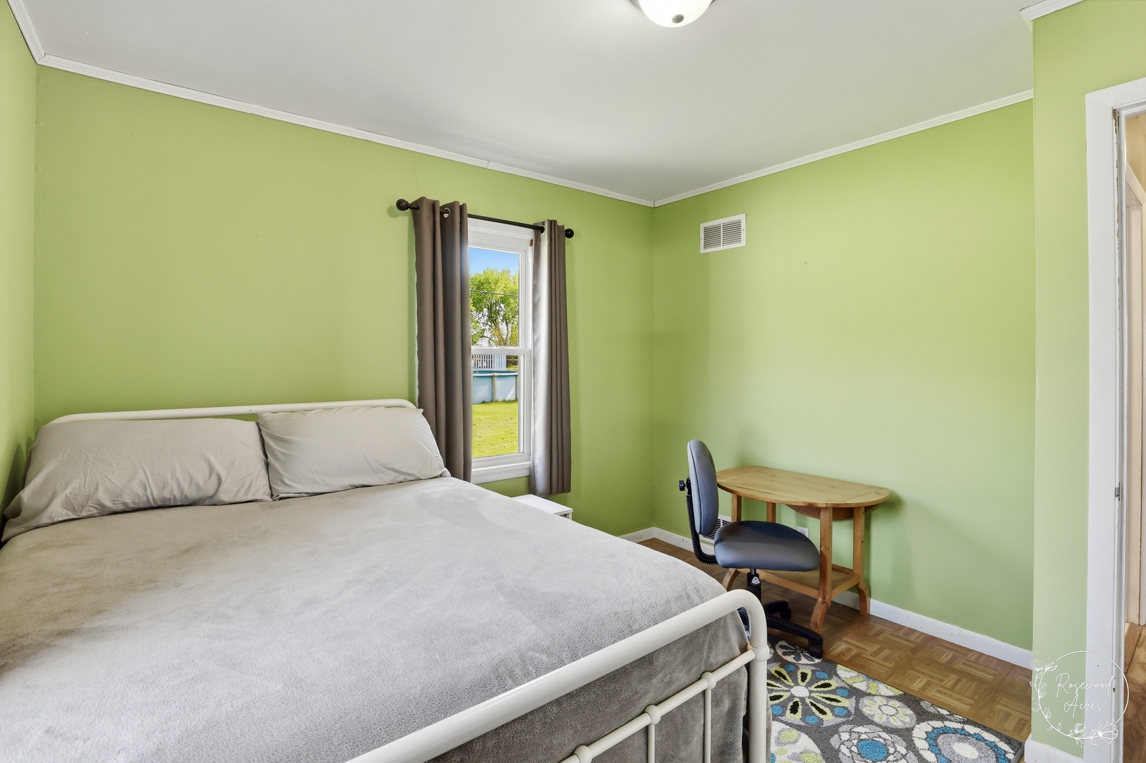 1769 West 2000S Road Kankakee, IL 60901 - Photo 14 of 39 a bedroom with a bed and a table in it
