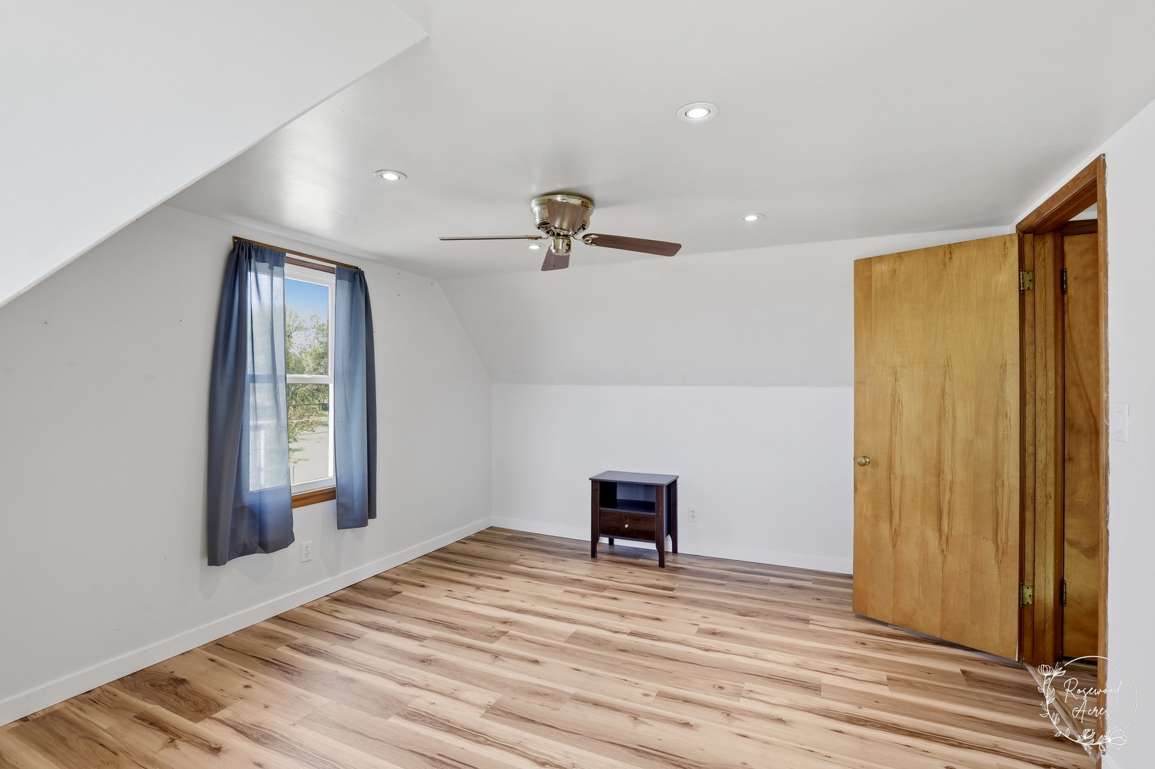 1769 West 2000S Road Kankakee, IL 60901 - Photo 16 of 39 a view of empty room with wooden floor and fan