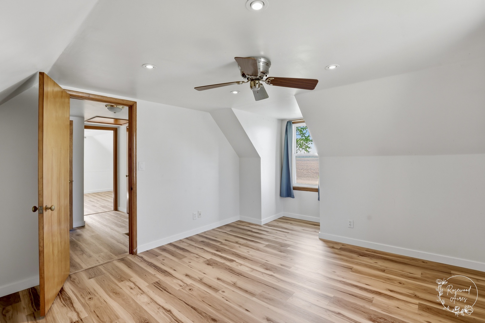 1769 West 2000S Road Kankakee, IL 60901 - Photo 18 of 39 a view of empty room with wooden floor and fan