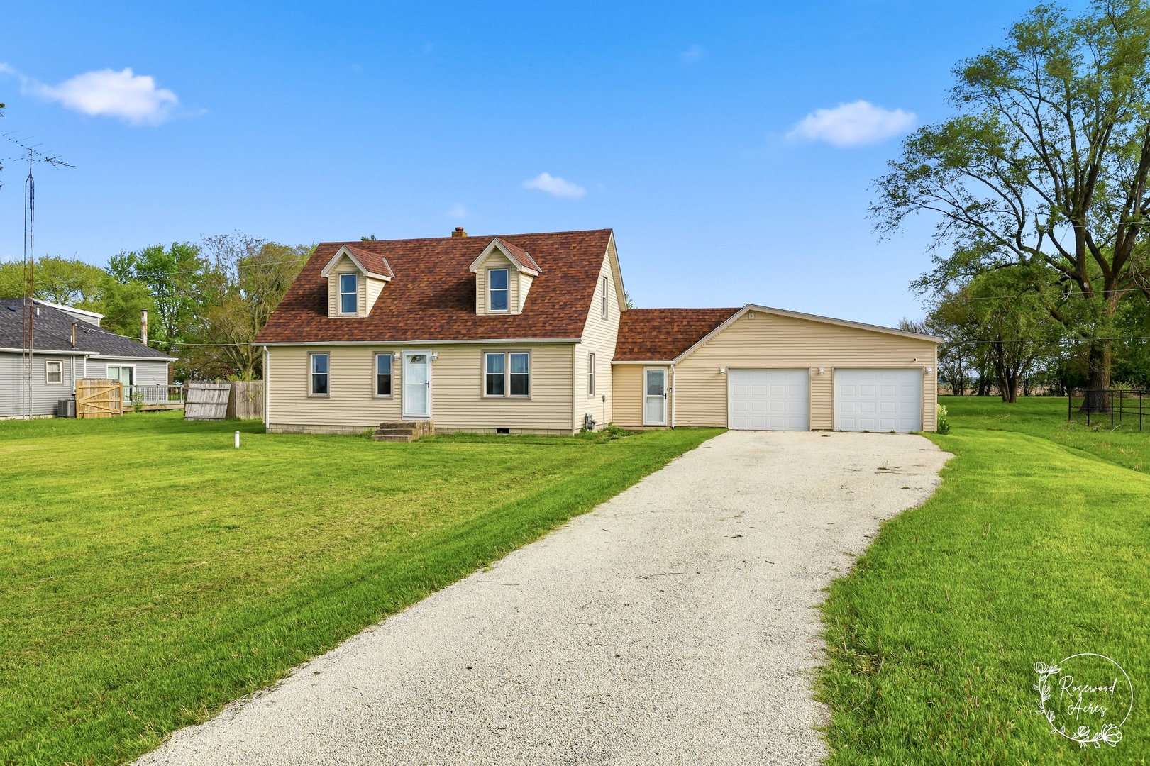 1769 West 2000S Road Kankakee, IL 60901 - Photo 3 of 39 a front view of a house with a yard and garage