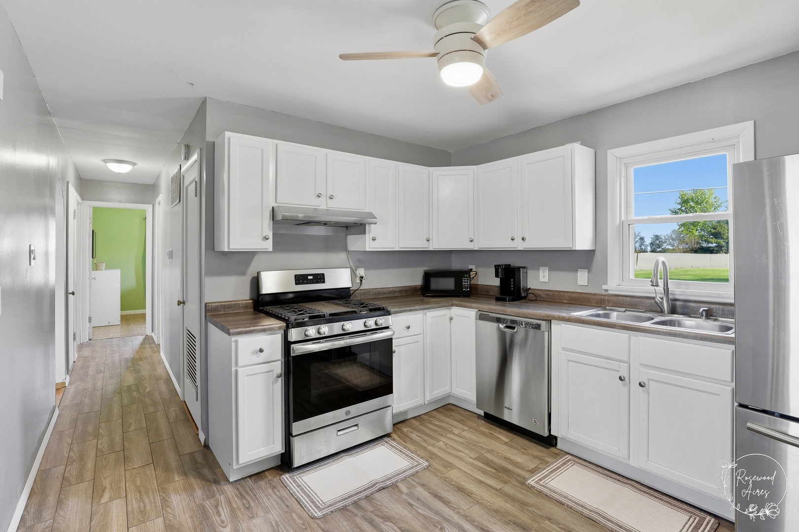 1769 West 2000S Road Kankakee, IL 60901 - Photo 4 of 39 a kitchen with stainless steel appliances granite countertop a stove a sink and a refrigerator