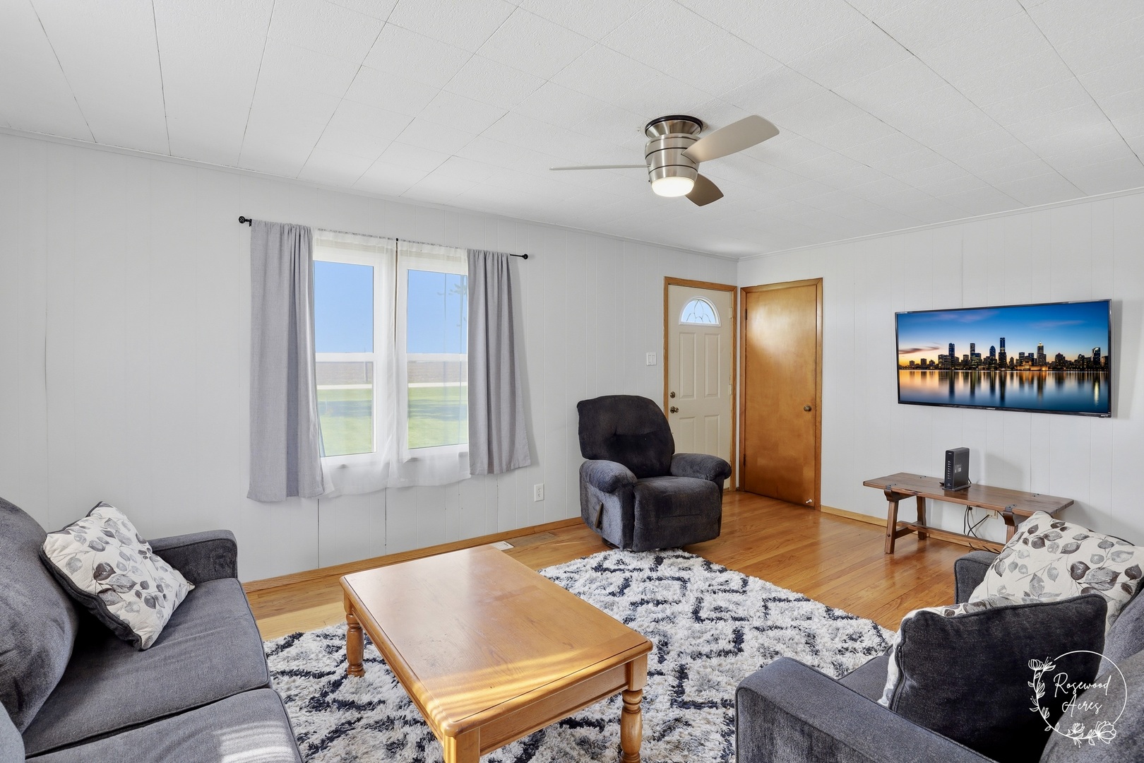 1769 West 2000S Road Kankakee, IL 60901 - Photo 6 of 39 a living room with furniture a rug and a window