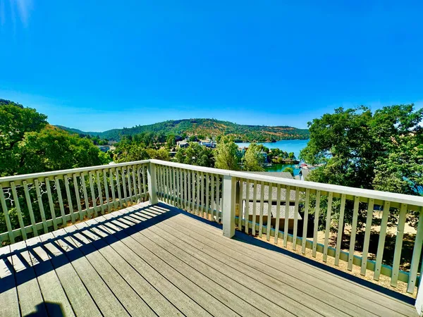 a view of balcony with wooden fence