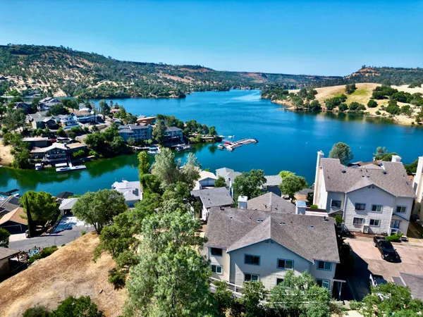 an aerial view of a house with a lake view