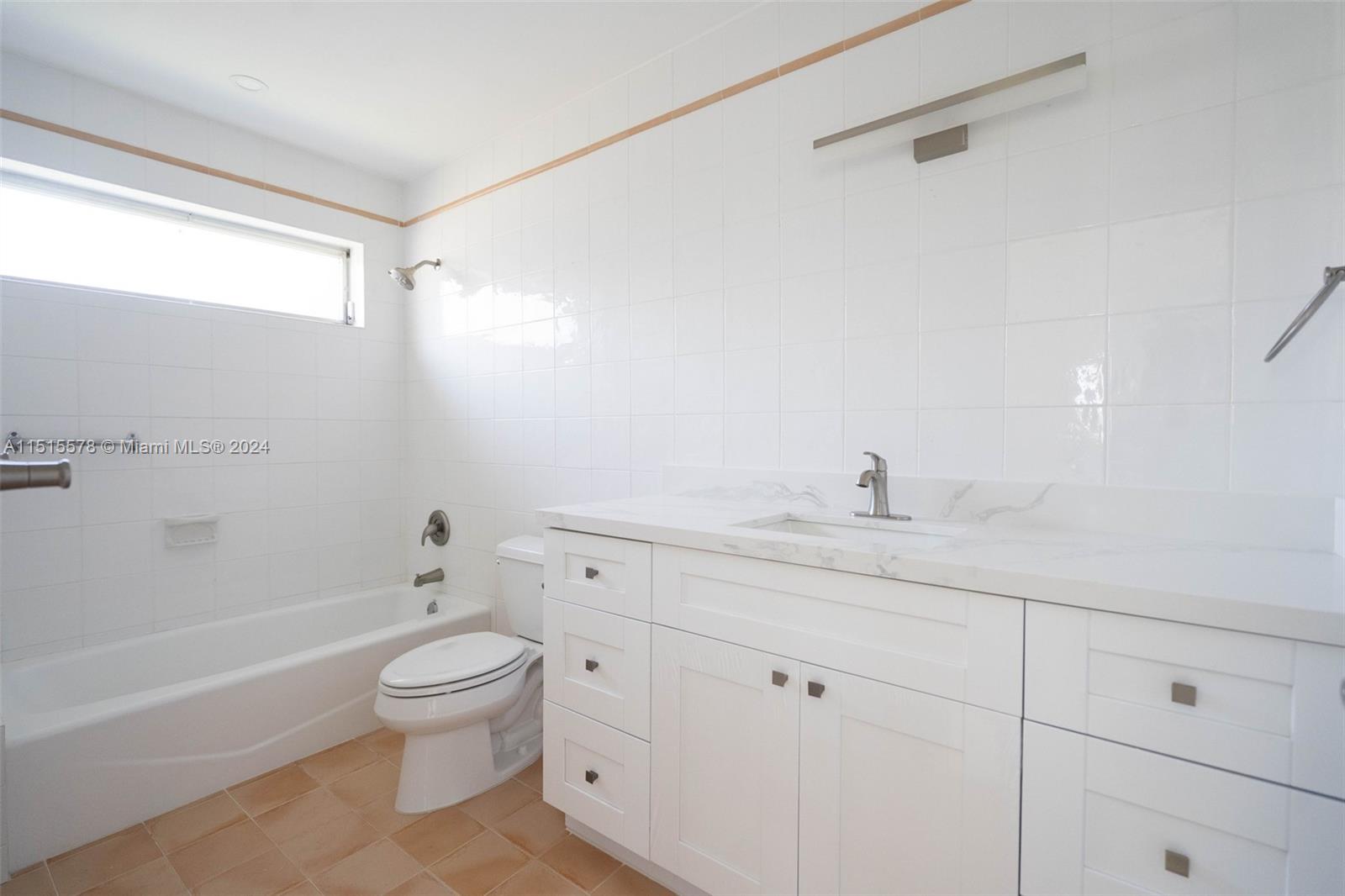 10540 Southwest 98th Street Miami, FL 33176 - Photo 12 of 21 a bathroom with a sink a toilet and shower