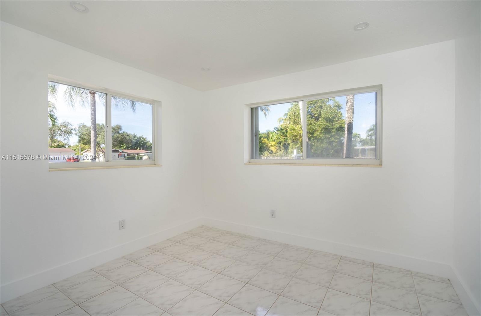 10540 Southwest 98th Street Miami, FL 33176 - Photo 13 of 21 an empty room with windows