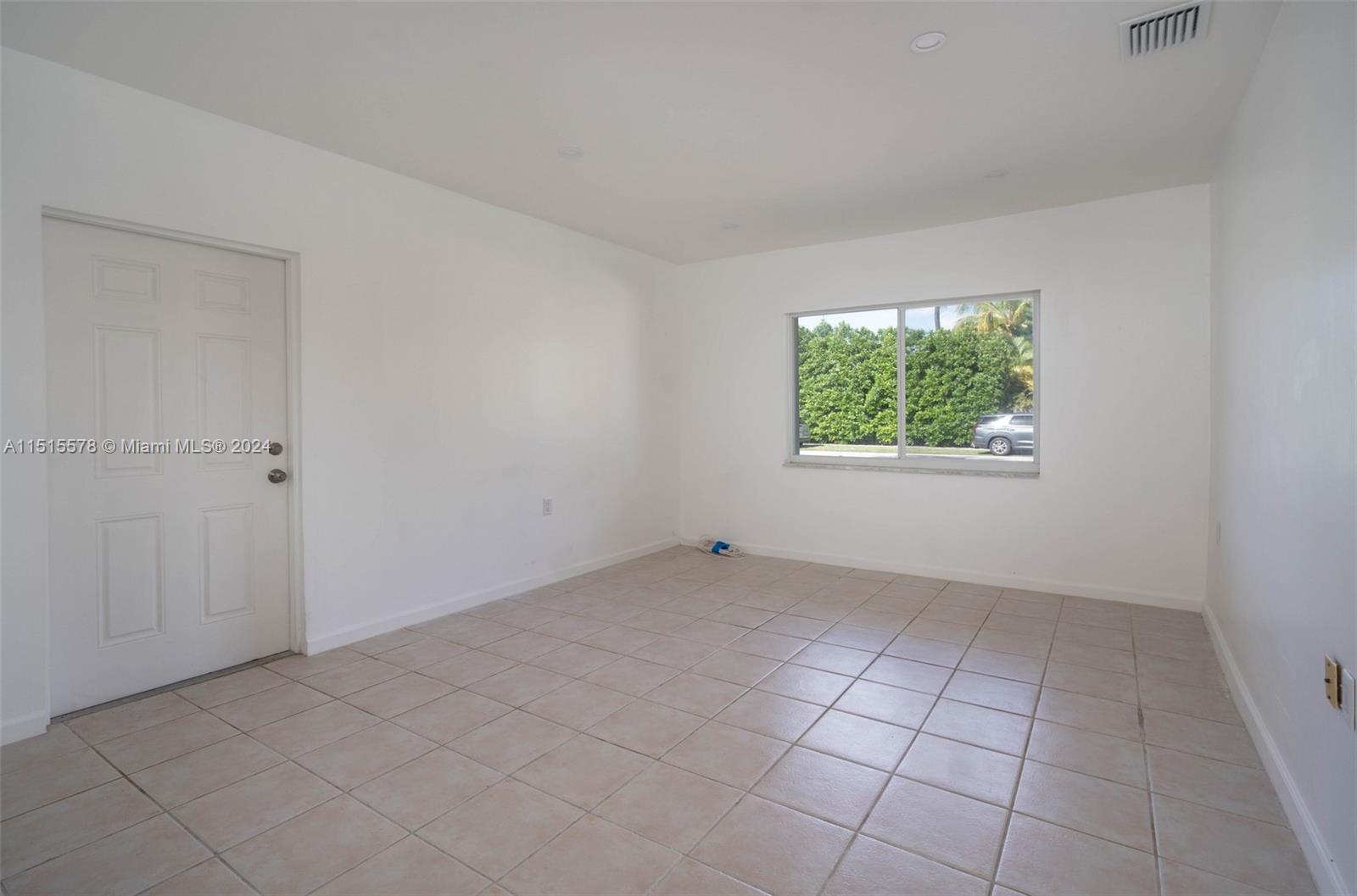 10540 Southwest 98th Street Miami, FL 33176 - Photo 14 of 21 an empty room with windows