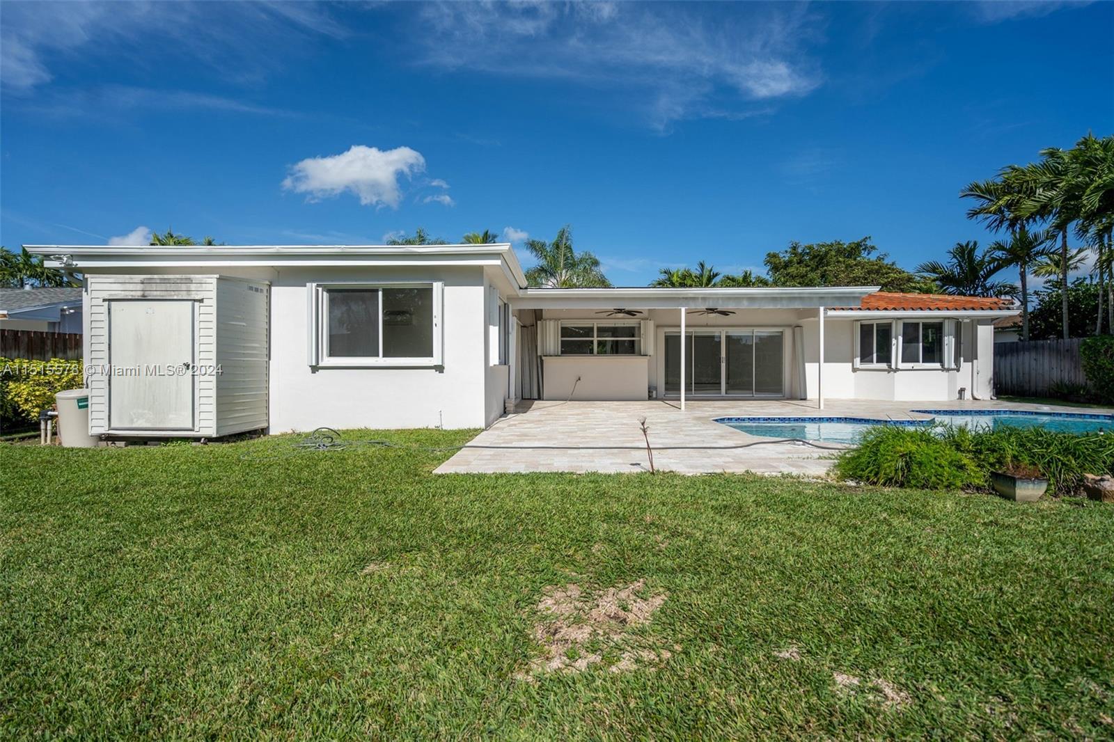 10540 Southwest 98th Street Miami, FL 33176 - Photo 16 of 21 a front view of a house with a yard
