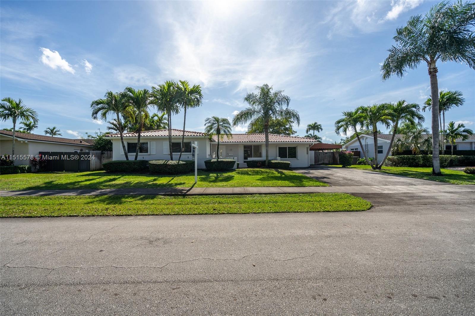 10540 Southwest 98th Street Miami, FL 33176 - Photo 19 of 21 a view of a house with a yard and palm trees