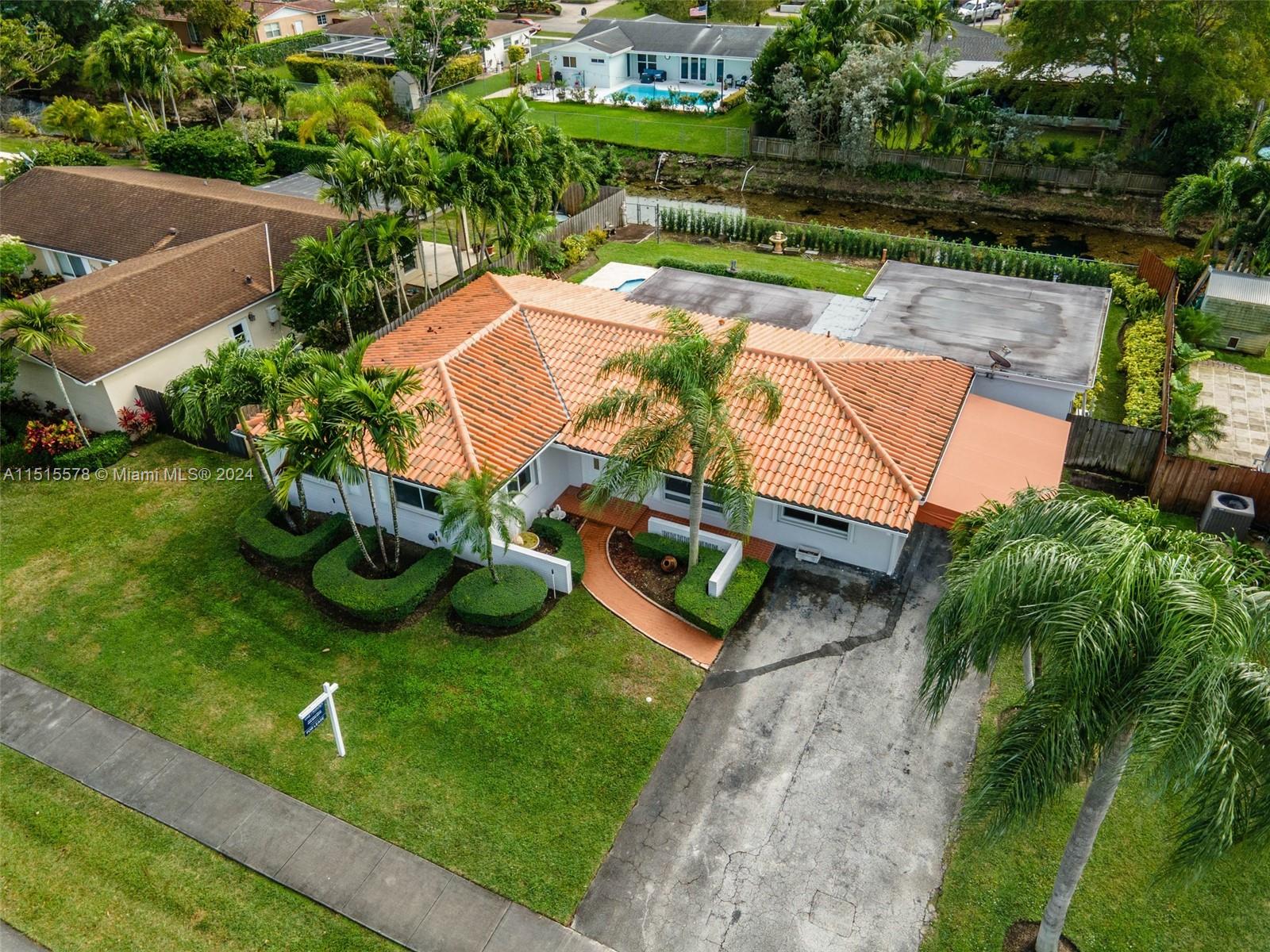 10540 Southwest 98th Street Miami, FL 33176 - Photo 3 of 21 an aerial view of a house with garden space and street view