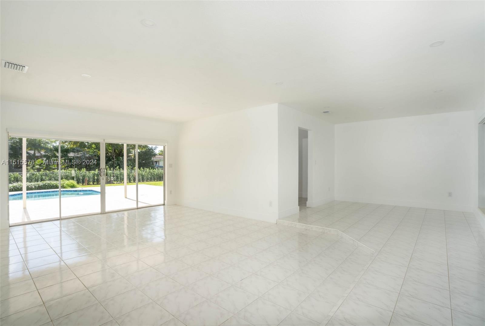 10540 Southwest 98th Street Miami, FL 33176 - Photo 5 of 21 an empty room with large windows