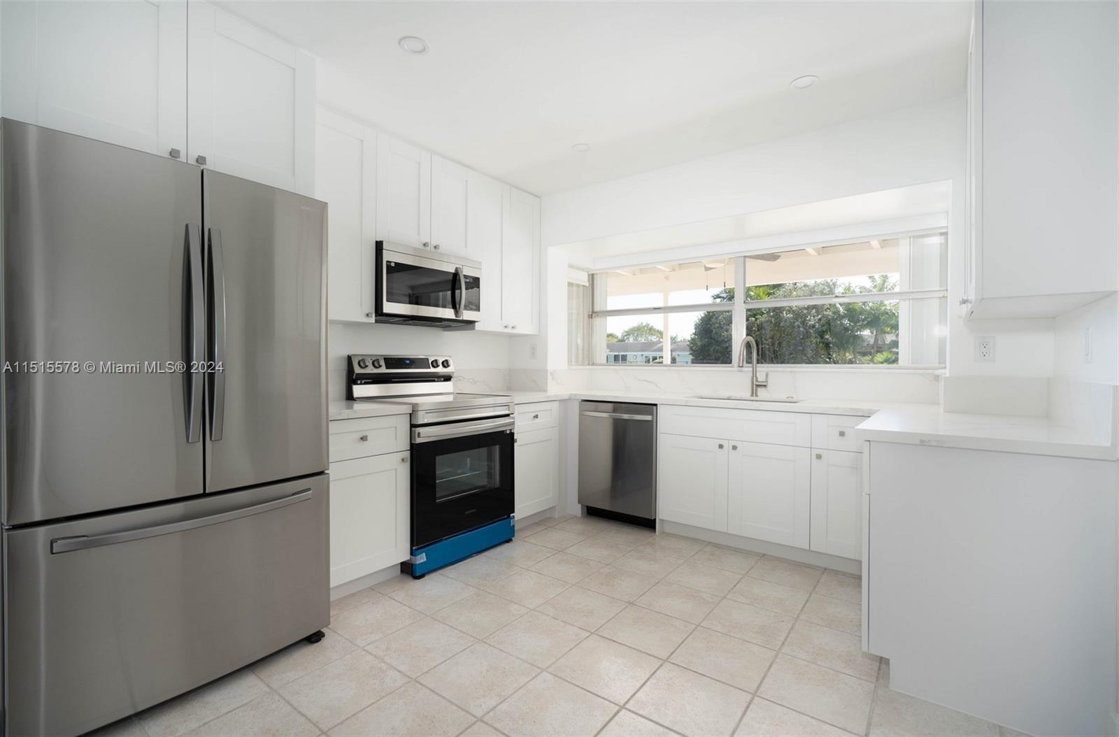 10540 Southwest 98th Street Miami, FL 33176 - Photo 7 of 21 a kitchen with a refrigerator sink and stove