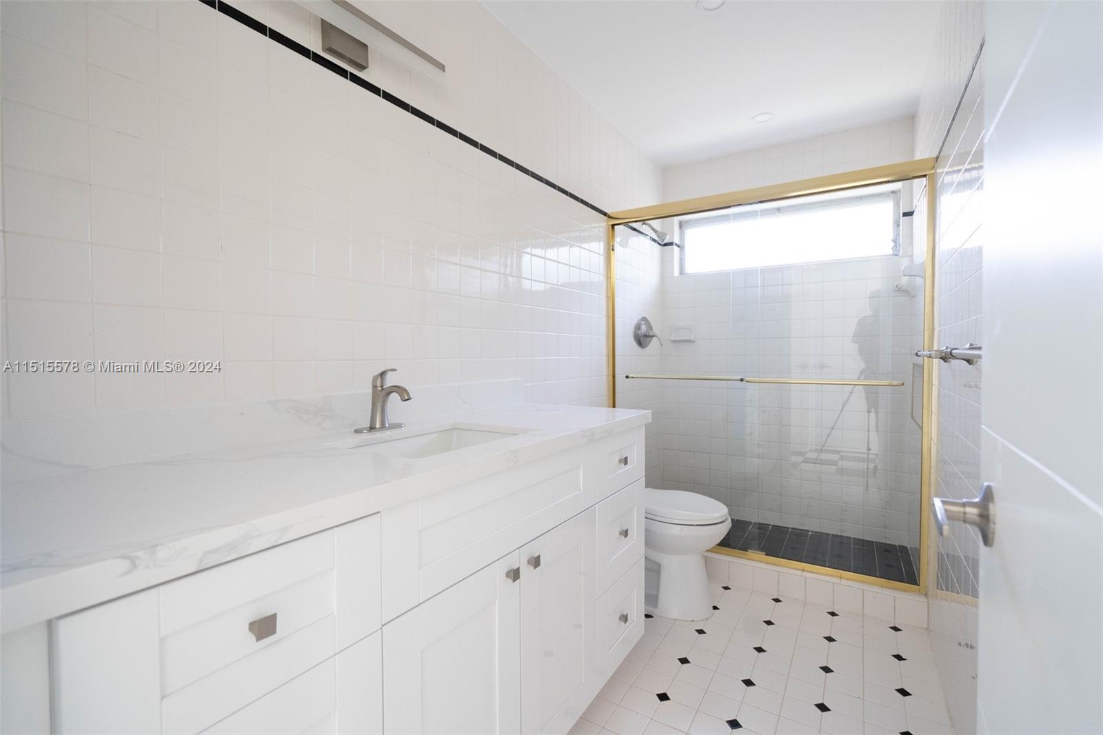 10540 Southwest 98th Street Miami, FL 33176 - Photo 10 of 21 a bathroom with a sink a toilet a shower and a mirror