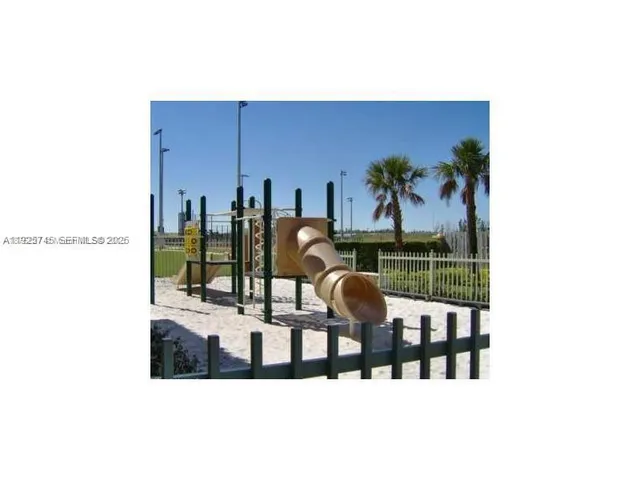 a balcony with table and chairs