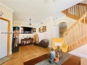 a view of a livingroom with furniture and a flat screen tv