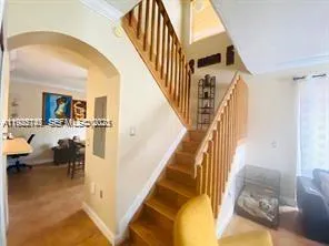 a view of living room with furniture and wooden floor