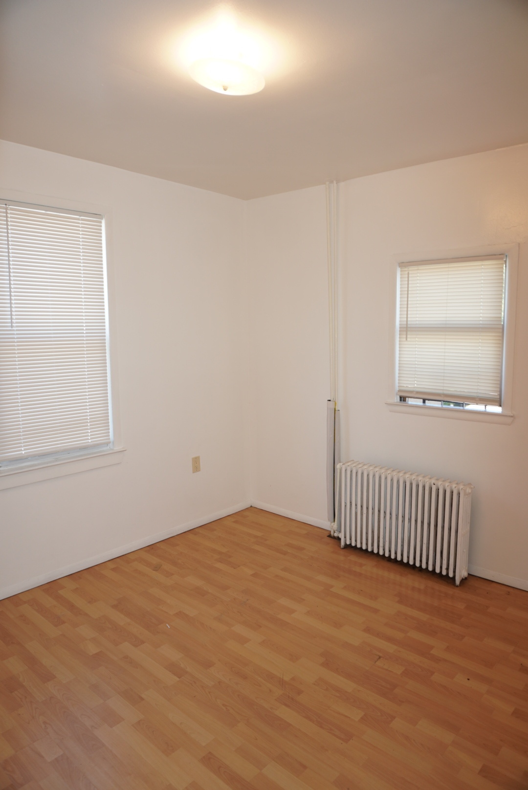 441 Castleton Avenue, Unit 2 Staten Island, NY 10301 - Photo 7 of 10 a view of a room with wooden floor