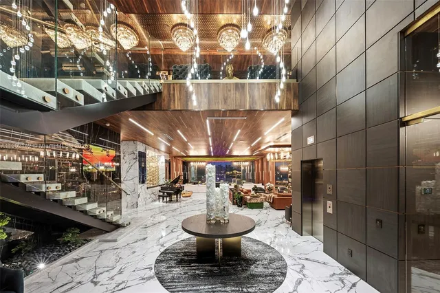 a view of a patio with table and chairs potted plants with wooden floor