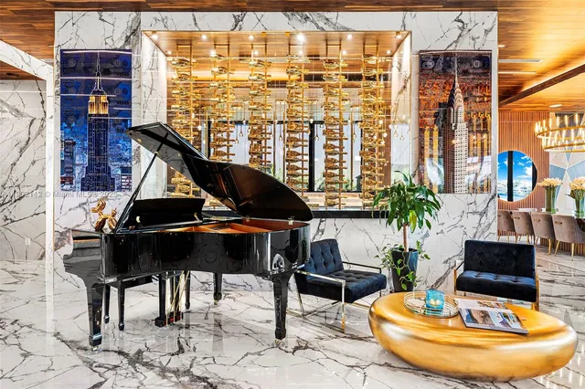 a kitchen with a large window and chairs