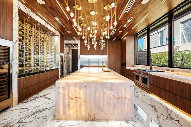 a bed sitting in a room next to a large window