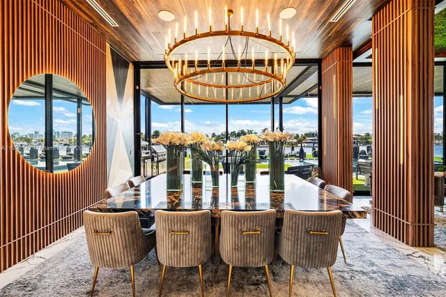 a bathroom with a granite countertop tub and a large window