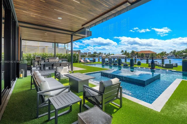 a kitchen with stainless steel appliances kitchen island granite countertop a sink and cabinets