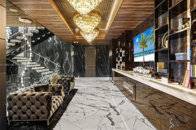 a backyard of a house with sofas and wooden fence