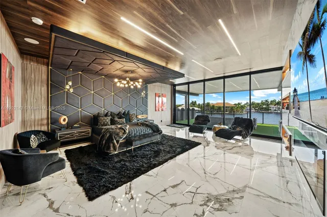 an aerial view of a house with a swimming pool yard and outdoor seating