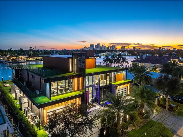 an aerial view of a pool patio chairs and a fire pit