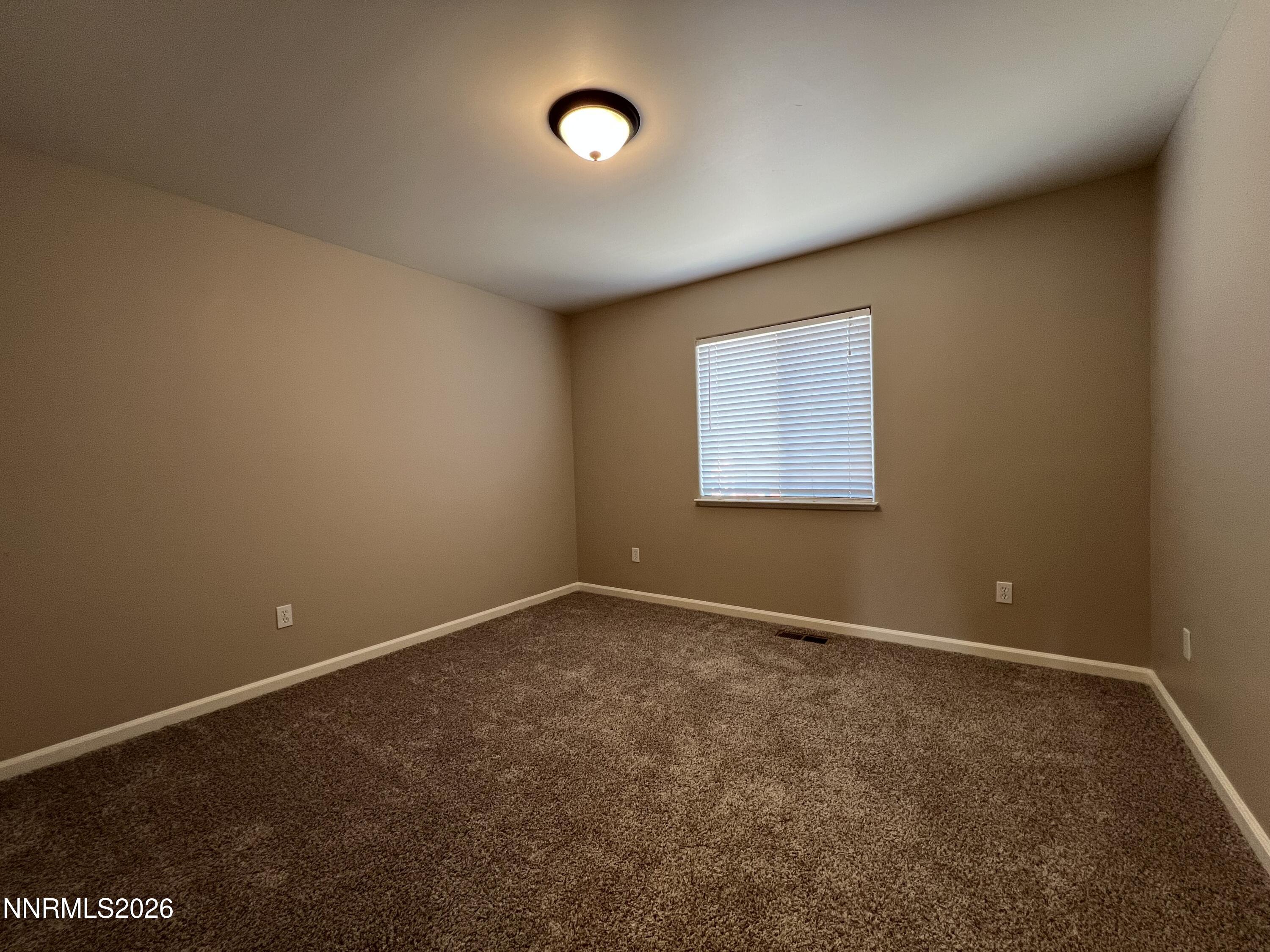 18406 Teddy Bear Court Reno, NV 89508 - Photo 27 of 44 an empty room with a window