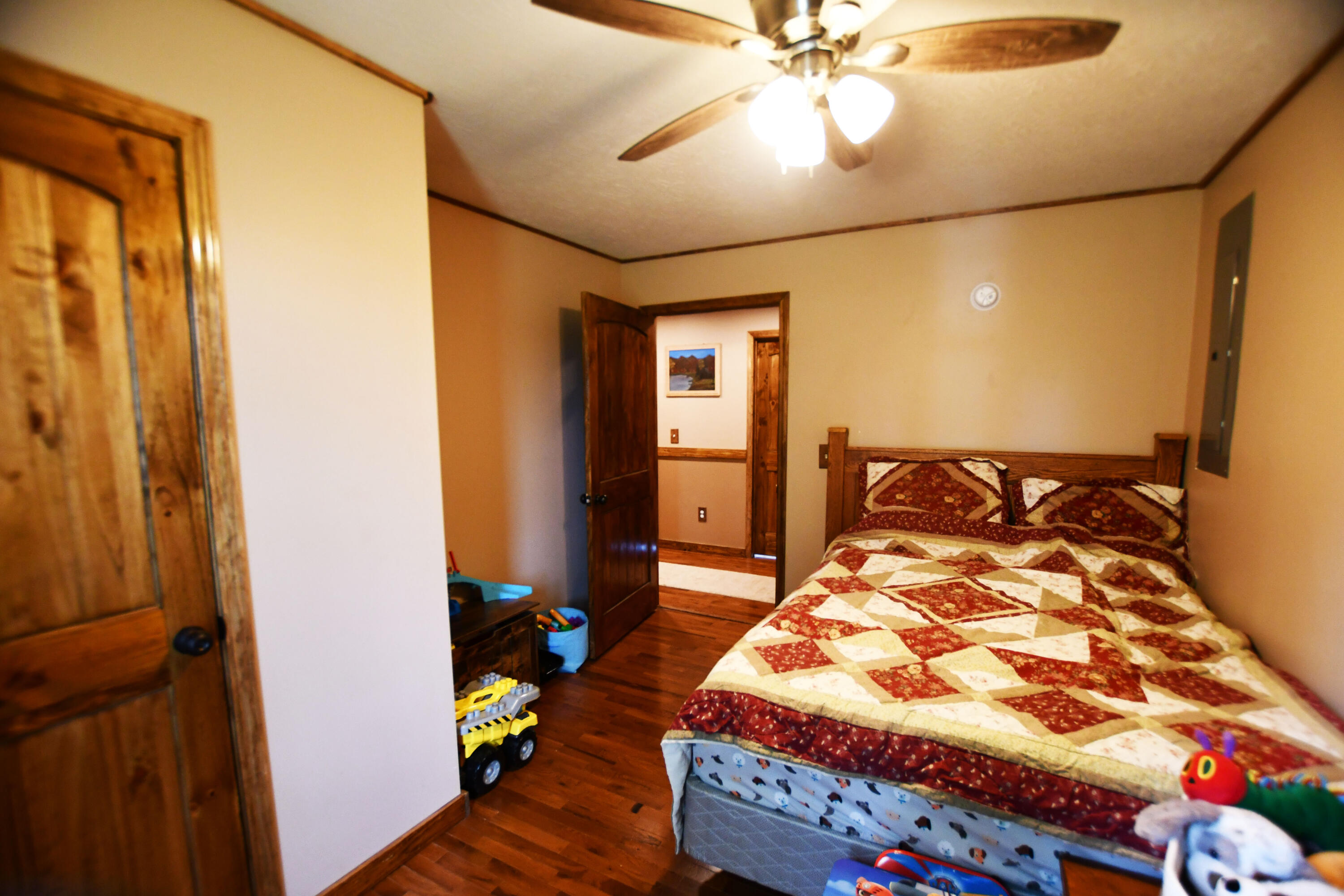 1410 Winston Road Irvine, KY 40336 - Photo 32 of 43 Second guest bedroom featuring hardwood floors, real wood doors, and plenty of space for family or guests!