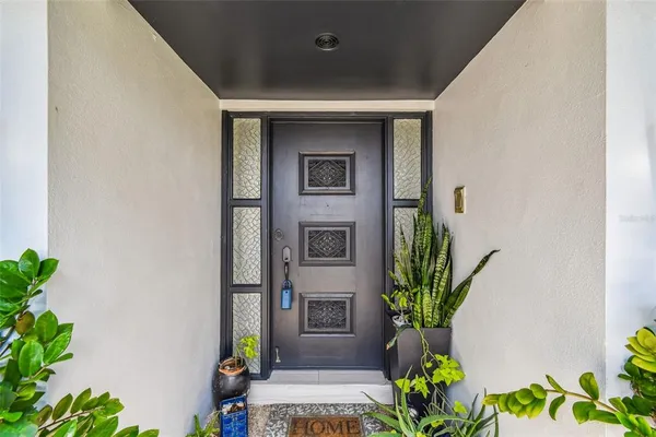 a kitchen with stainless steel appliances granite countertop a sink and a refrigerator
