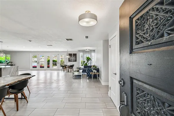 a kitchen with a sink a counter top space stainless steel appliances and cabinets