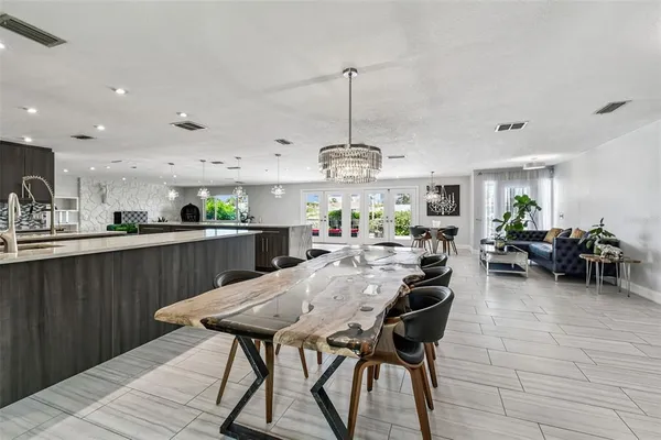 a kitchen with stainless steel appliances granite countertop a sink and a stove