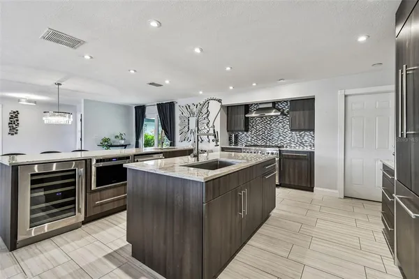 a bathroom with a sink a toilet a mirror and shower