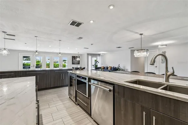 a bathroom with a granite countertop bathtub shower and mirror